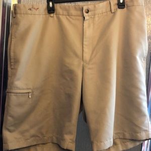 Greg Norman golf shirts, size 40 in a khaki to tan color. 2 side pockets